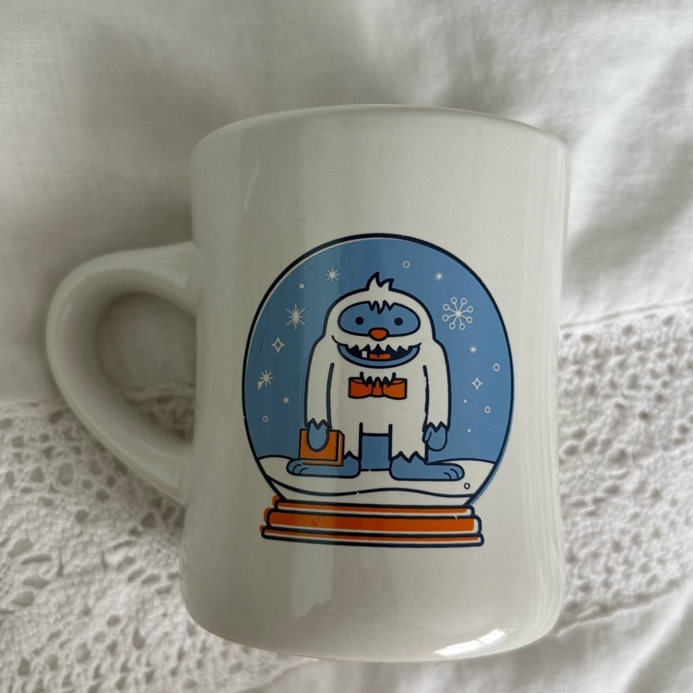 Powell Bookstore Ceramic Mug winter yeti holiday snow globe snowflake 10 oz